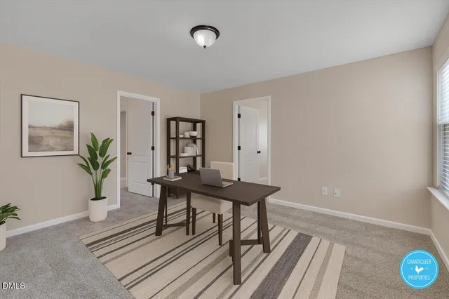 a view of a room with furniture and wooden floor