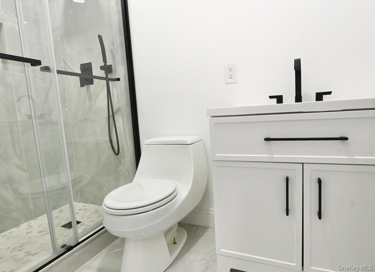 2 Little Hill East Setauket, NY 11733 - Photo 15 of 22 a bathroom with a toilet and a shower