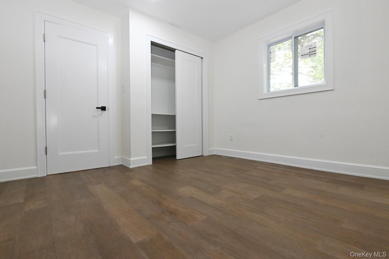 2 Little Hill East Setauket, NY 11733 - Photo 16 of 22 a view of an empty room with closet and a window