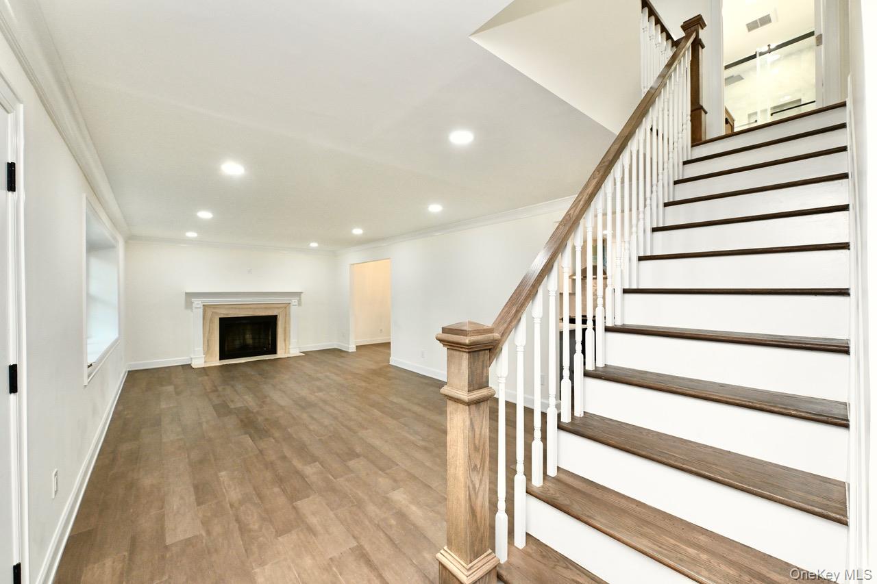 2 Little Hill East Setauket, NY 11733 - Photo 3 of 22 a view of entryway and hall with wooden floor