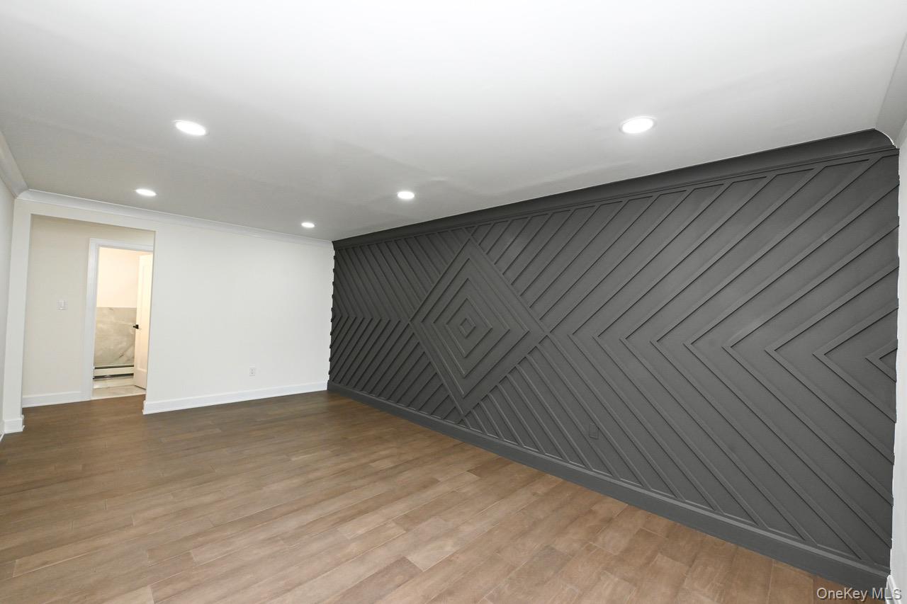 2 Little Hill East Setauket, NY 11733 - Photo 5 of 22 a view of an empty room with wooden floor