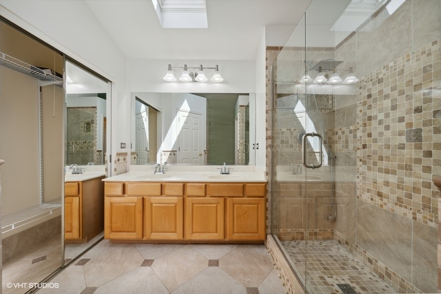 1824 Red Bud Road Bolingbrook, IL 60490 - Photo 13 of 22 a bathroom with a double vanity sink mirror and shower
