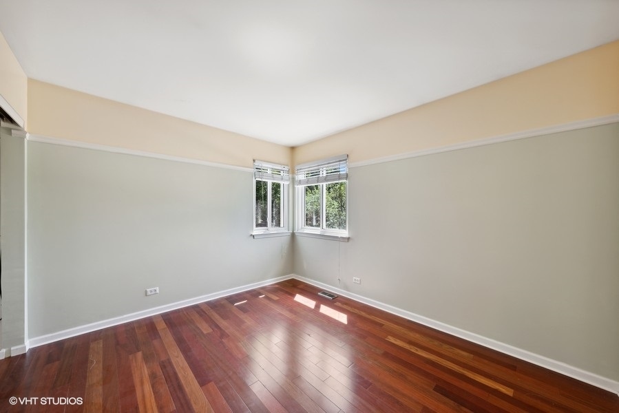 1824 Red Bud Road Bolingbrook, IL 60490 - Photo 15 of 22 a view of a room with wooden floor and white walls