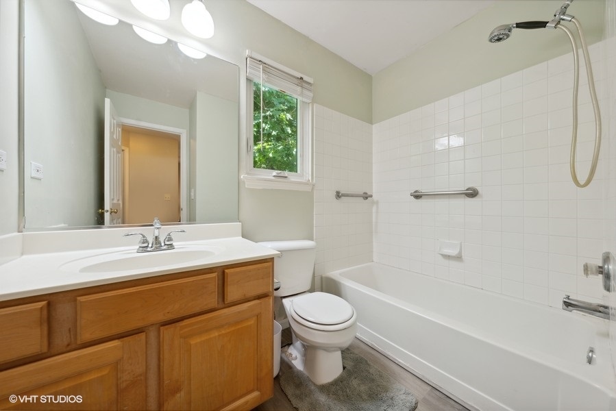 1824 Red Bud Road Bolingbrook, IL 60490 - Photo 16 of 22 a bathroom with a sink a toilet and shower