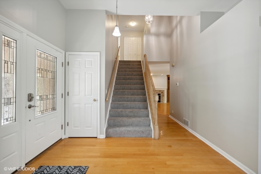 1824 Red Bud Road Bolingbrook, IL 60490 - Photo 2 of 22 a view of entryway and hall with wooden floor
