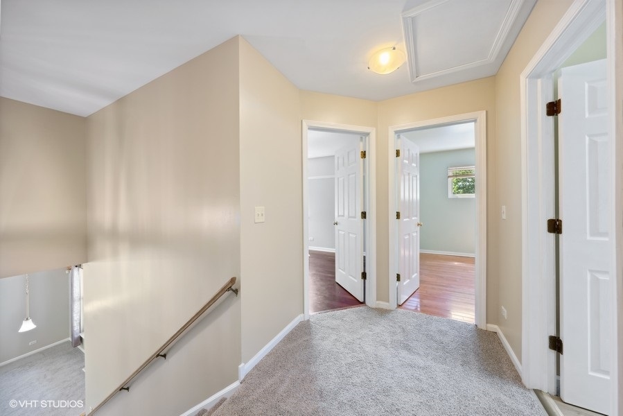 1824 Red Bud Road Bolingbrook, IL 60490 - Photo 10 of 22 a view of a hallway with wooden shelves
