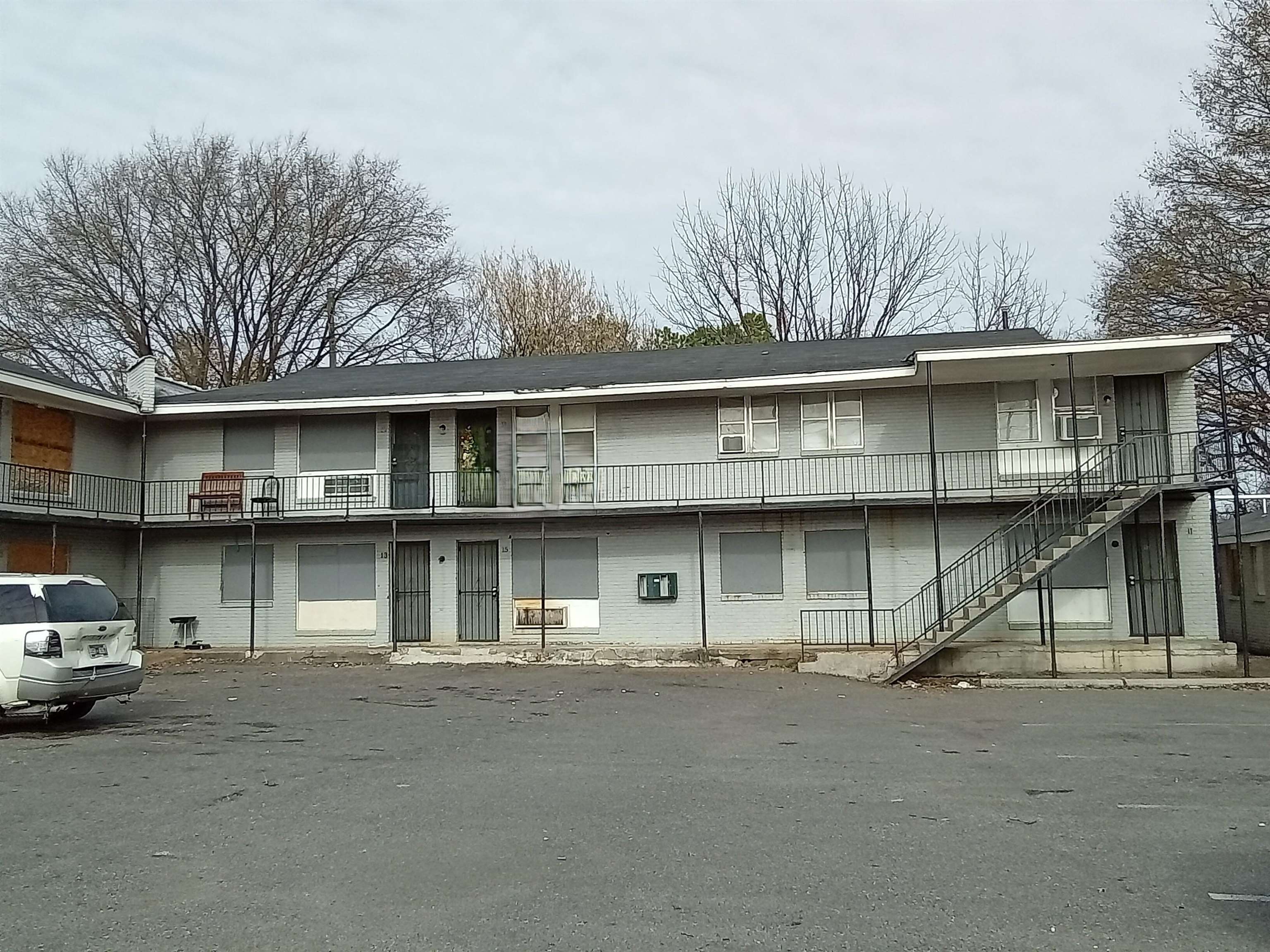 View of property featuring stairs