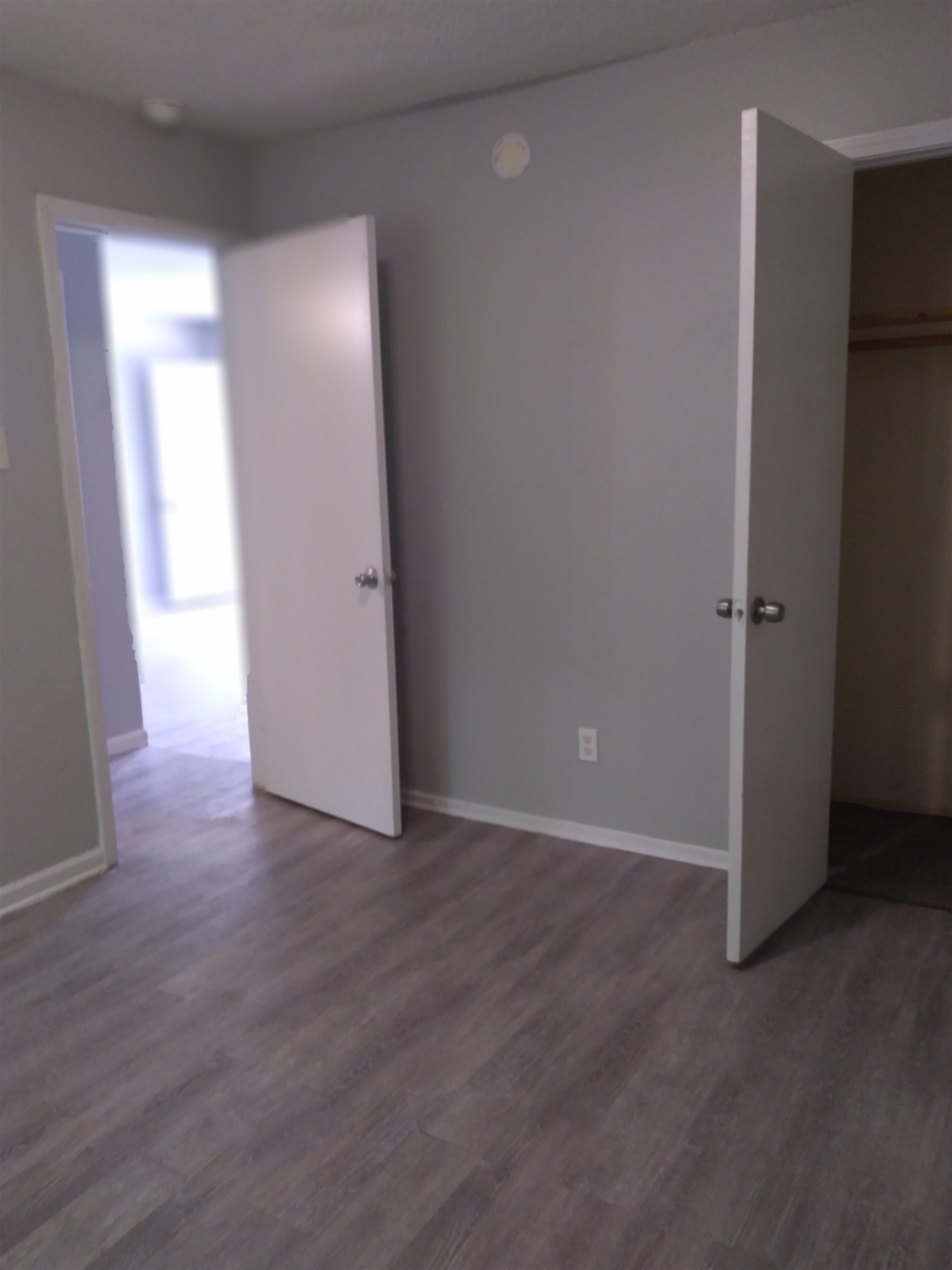 2116 Howell Avenue Memphis, TN 38108 - Photo 2 of 5 Unfurnished bedroom with dark wood-style floors and baseboards