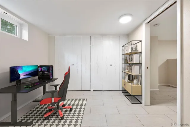 a view of a room with wooden floor and window