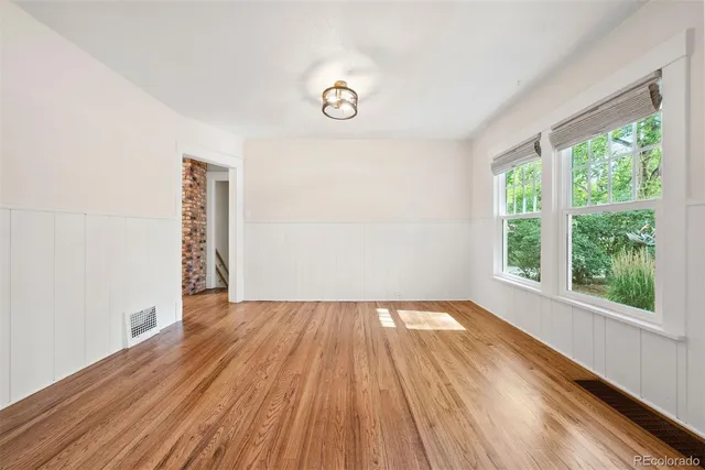 an aerial view of a house with a backyard