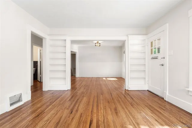 a kitchen with kitchen island a sink stove and refrigerator