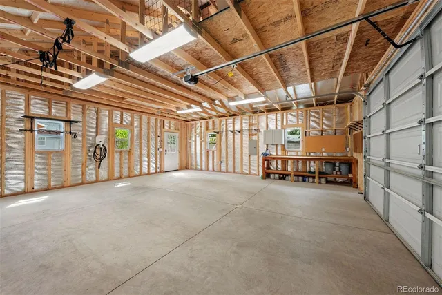 a view of a house with a small yard and wooden floor