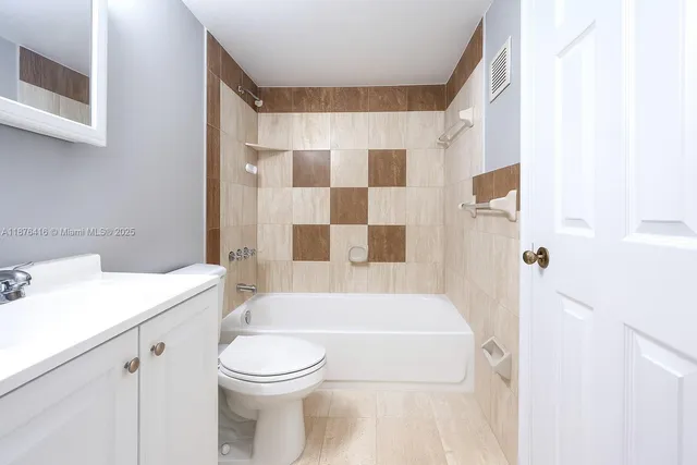 a bathroom with a sink a toilet and a bathtub