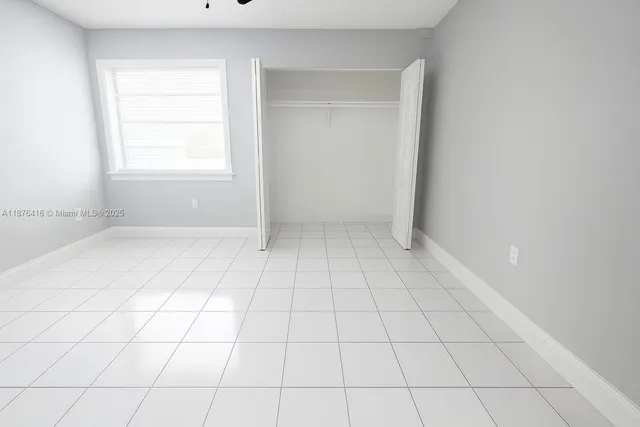 a view of an empty room and window