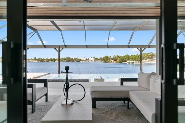 a view of a room with a table and chairs