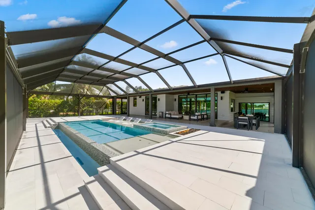 a view of swimming pool with seating area