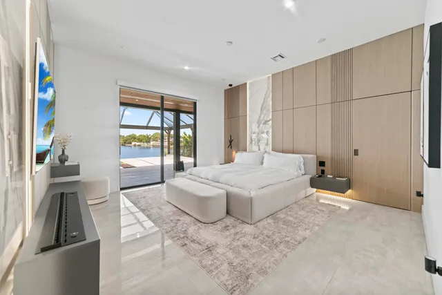 a spacious bedroom with a bed and a window