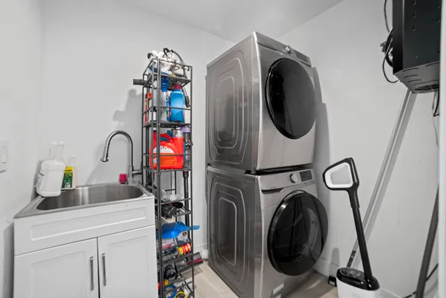 a close view of a utility room with dryer and washer