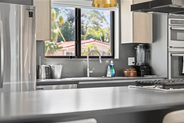 a kitchen with a sink and a window