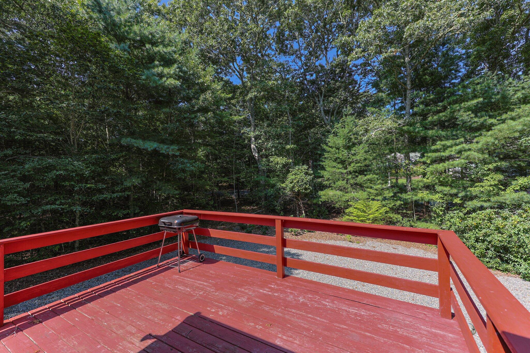 87 Fuller Road Centerville, MA 02632 - Photo 28 of 33 a view of sitting area with wooden fence and trees