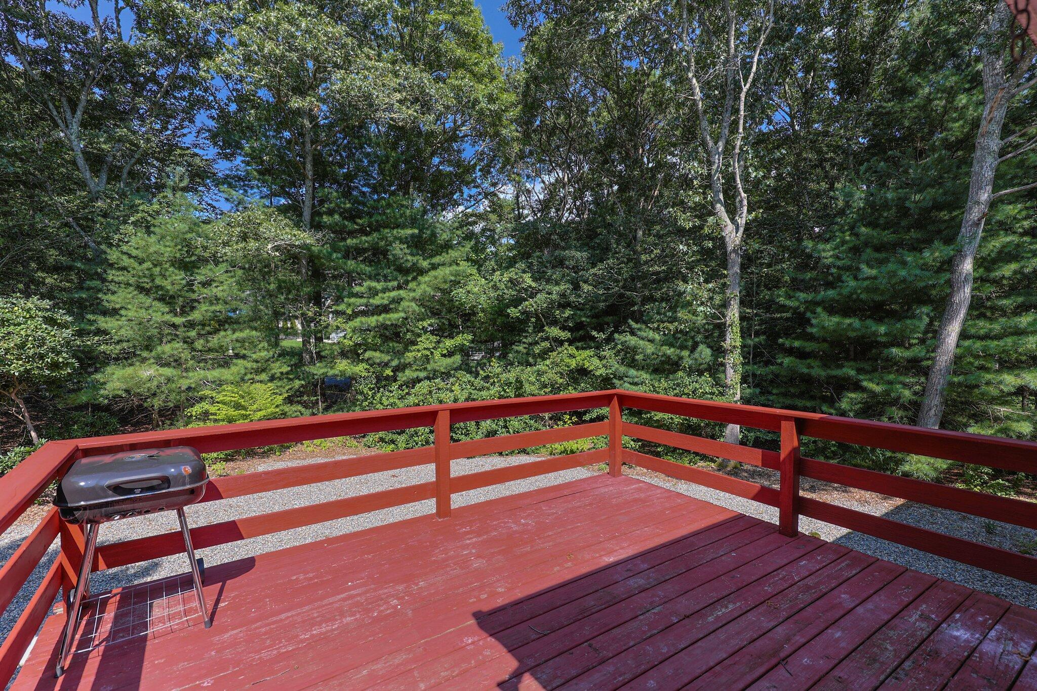 87 Fuller Road Centerville, MA 02632 - Photo 29 of 33 a wooden bench sitting in the middle of a park