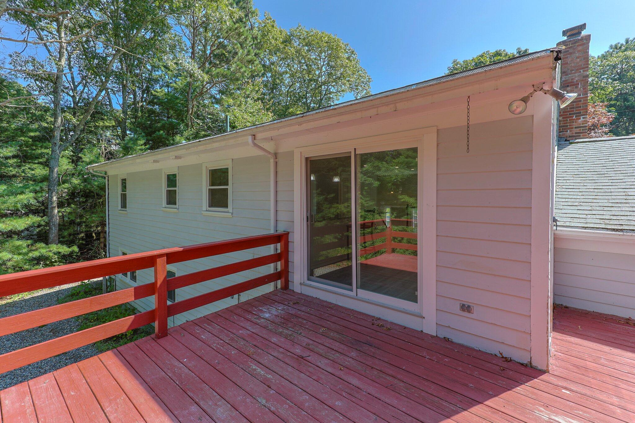 87 Fuller Road Centerville, MA 02632 - Photo 30 of 33 a view of a house with a deck
