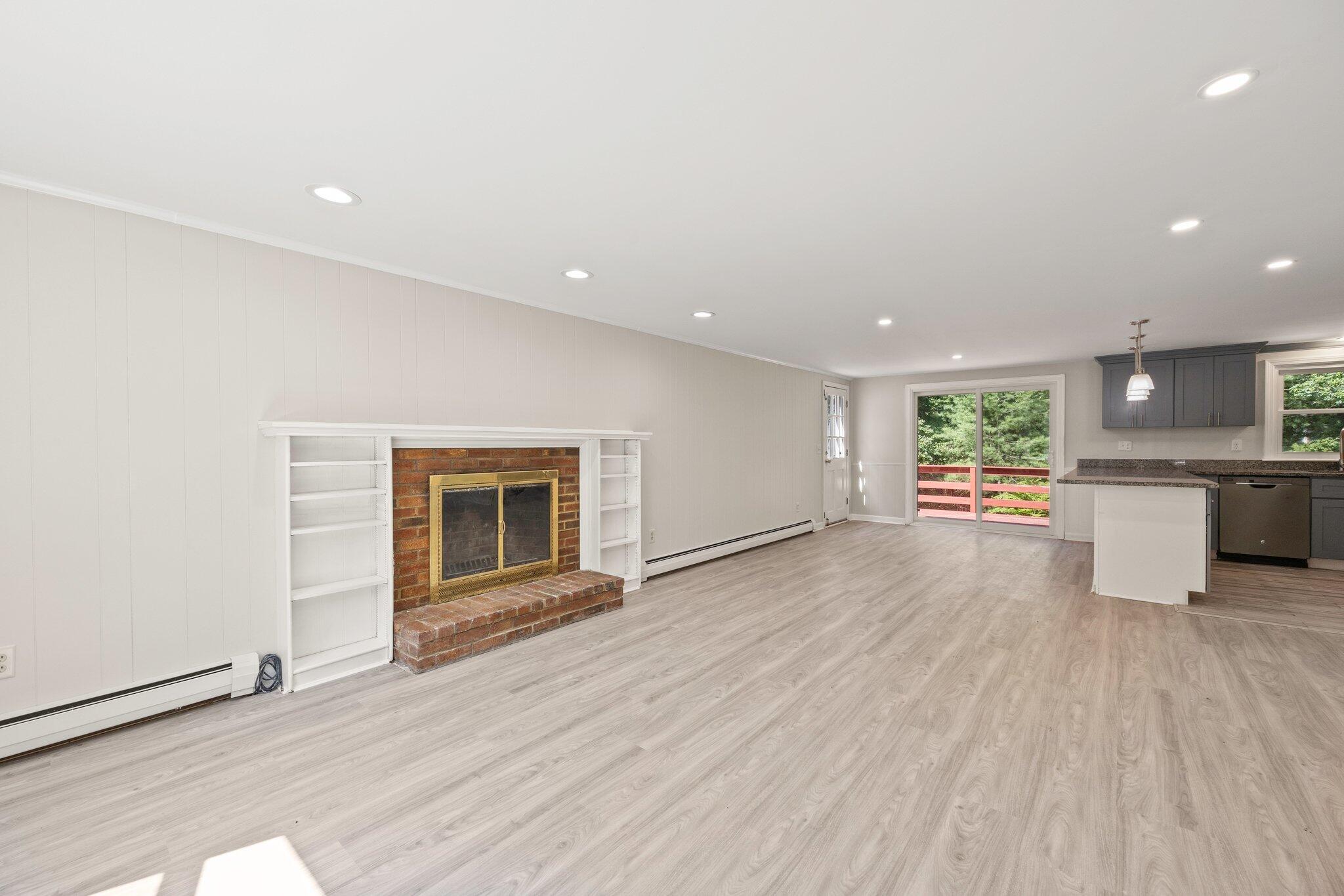 87 Fuller Road Centerville, MA 02632 - Photo 4 of 33 a view of a big room with wooden floor and windows
