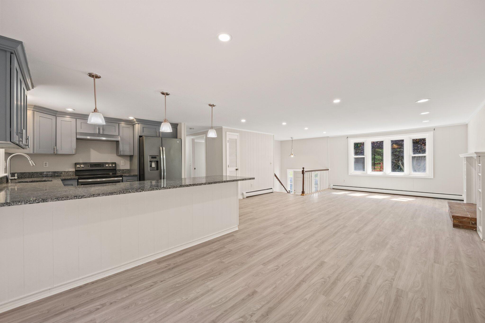 87 Fuller Road Centerville, MA 02632 - Photo 6 of 33 a large white kitchen with stainless steel appliances