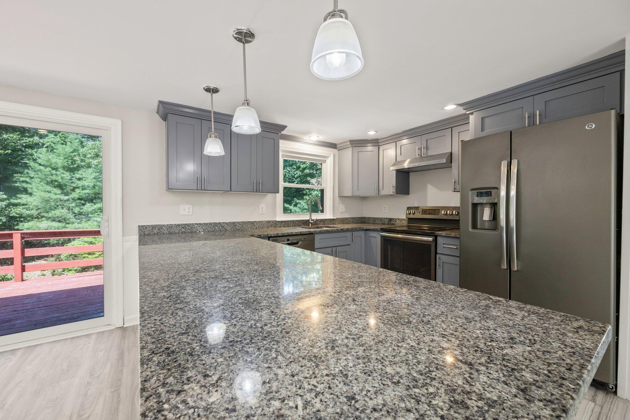 87 Fuller Road Centerville, MA 02632 - Photo 8 of 33 a kitchen with refrigerator and window
