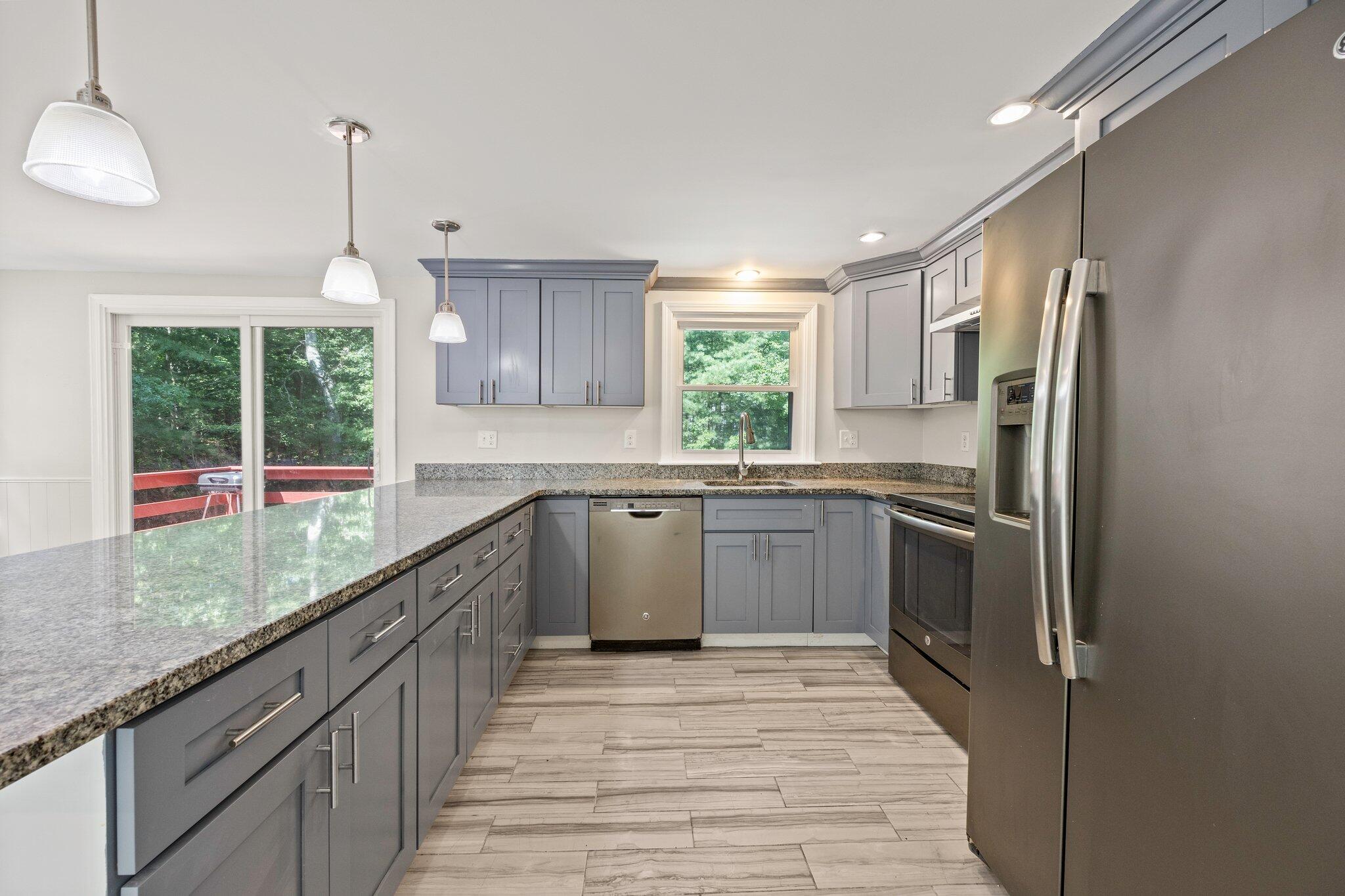 87 Fuller Road Centerville, MA 02632 - Photo 9 of 33 a kitchen with a sink appliances cabinets and a large window