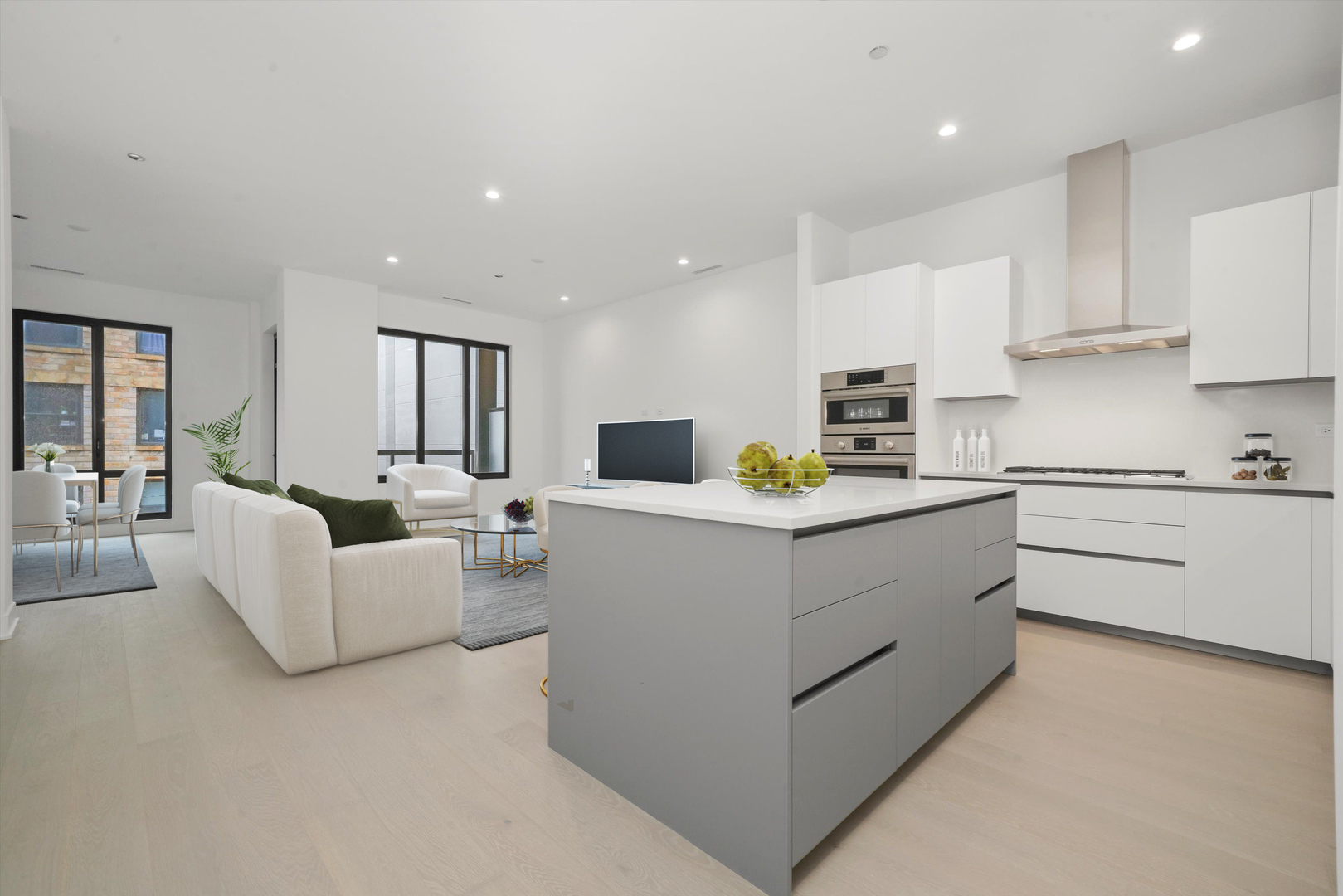 323 South Racine Avenue, Unit 3C Chicago, IL 60607 - Photo 3 of 18 a kitchen with white cabinets and stainless steel appliances