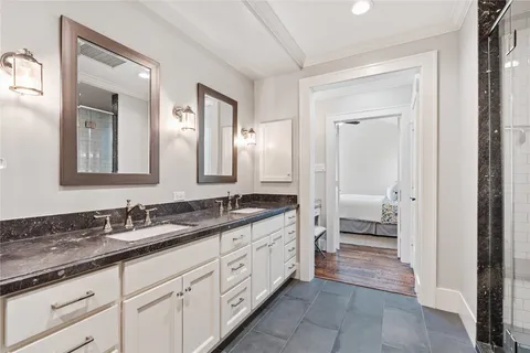 a large white kitchen with granite countertop cabinets and a granite counter tops