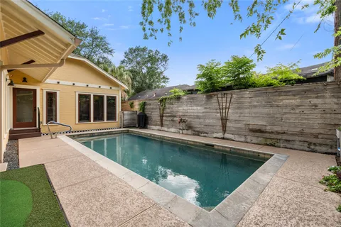a view of a swimming pool with a patio