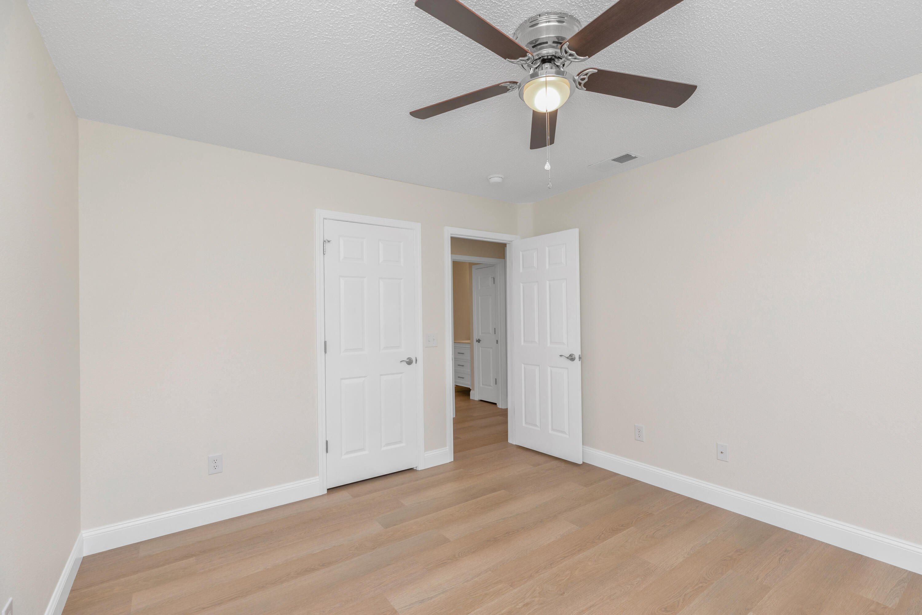 203 Riverchase Boulevard Crestview, FL 32536 - Photo 23 of 36 an empty room with fan and a ceiling fan