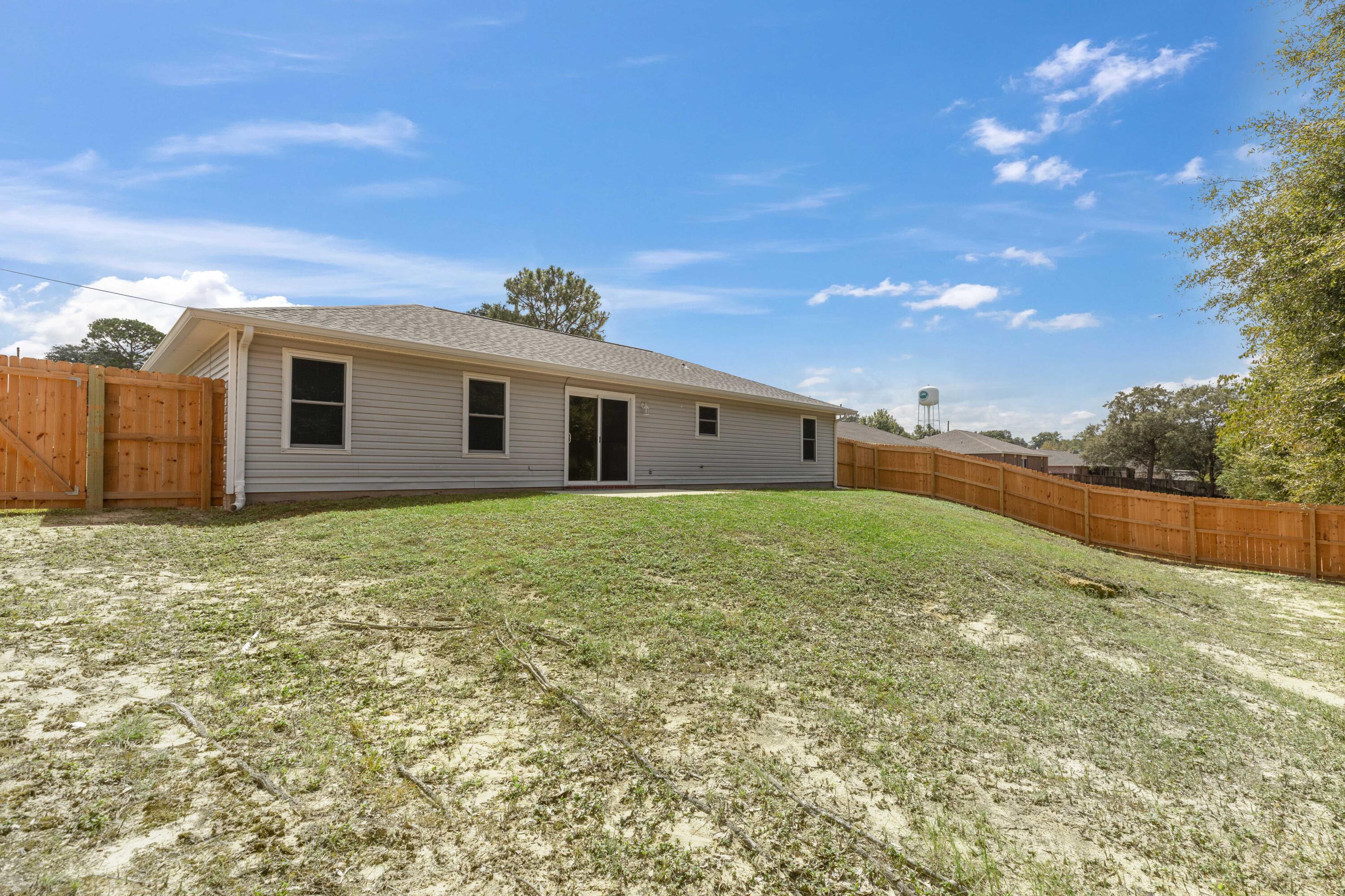 203 Riverchase Boulevard Crestview, FL 32536 - Photo 35 of 36 a view of a house with a backyard