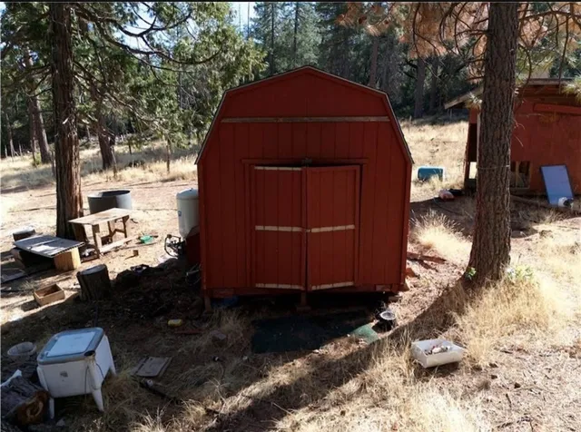 a view of a chairs and tables in the back yard of the house
