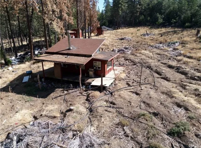 a view of a backyard of the house