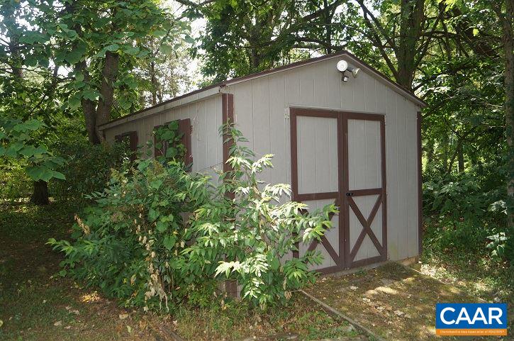 84 Wedgestone Road Stanardsville, VA 22973 - Photo 12 of 34 a front view of a house with garden