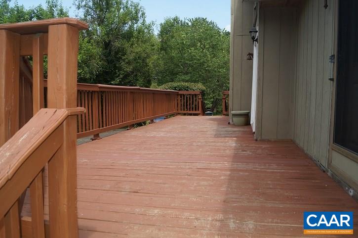 84 Wedgestone Road Stanardsville, VA 22973 - Photo 13 of 34 a view of backyard with wooden fence and trees