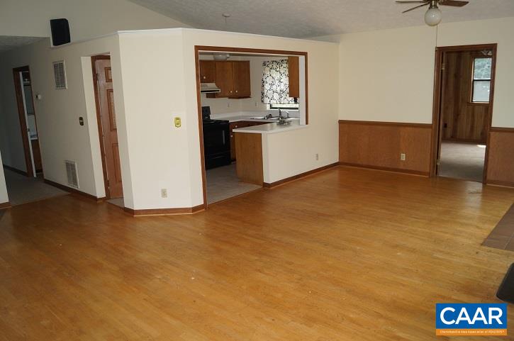 84 Wedgestone Road Stanardsville, VA 22973 - Photo 17 of 34 a view of a kitchen with a sink cabinet and a window