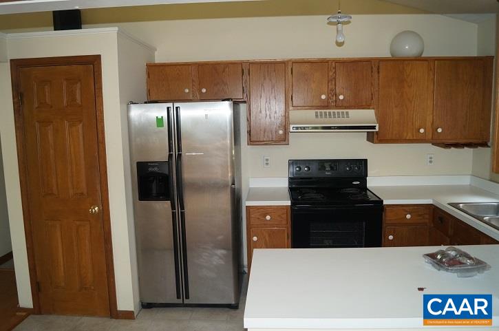84 Wedgestone Road Stanardsville, VA 22973 - Photo 22 of 34 a kitchen with a refrigerator and a stove