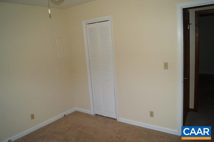 84 Wedgestone Road Stanardsville, VA 22973 - Photo 26 of 34 an empty room with a door