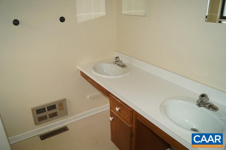 84 Wedgestone Road Stanardsville, VA 22973 - Photo 30 of 34 a bathroom with a sink and a tub