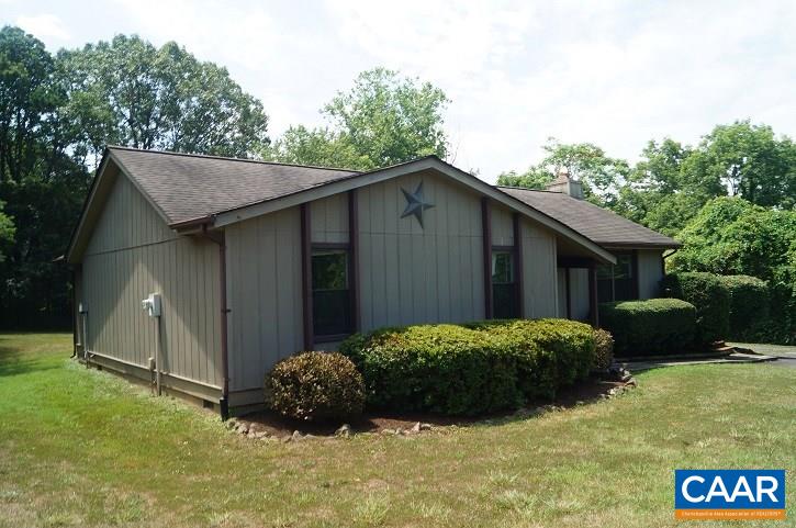 84 Wedgestone Road Stanardsville, VA 22973 - Photo 3 of 34 a view of a house with a backyard and trees