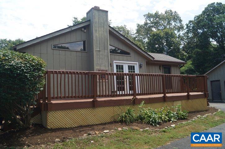 84 Wedgestone Road Stanardsville, VA 22973 - Photo 6 of 34 a view of a deck with a yard