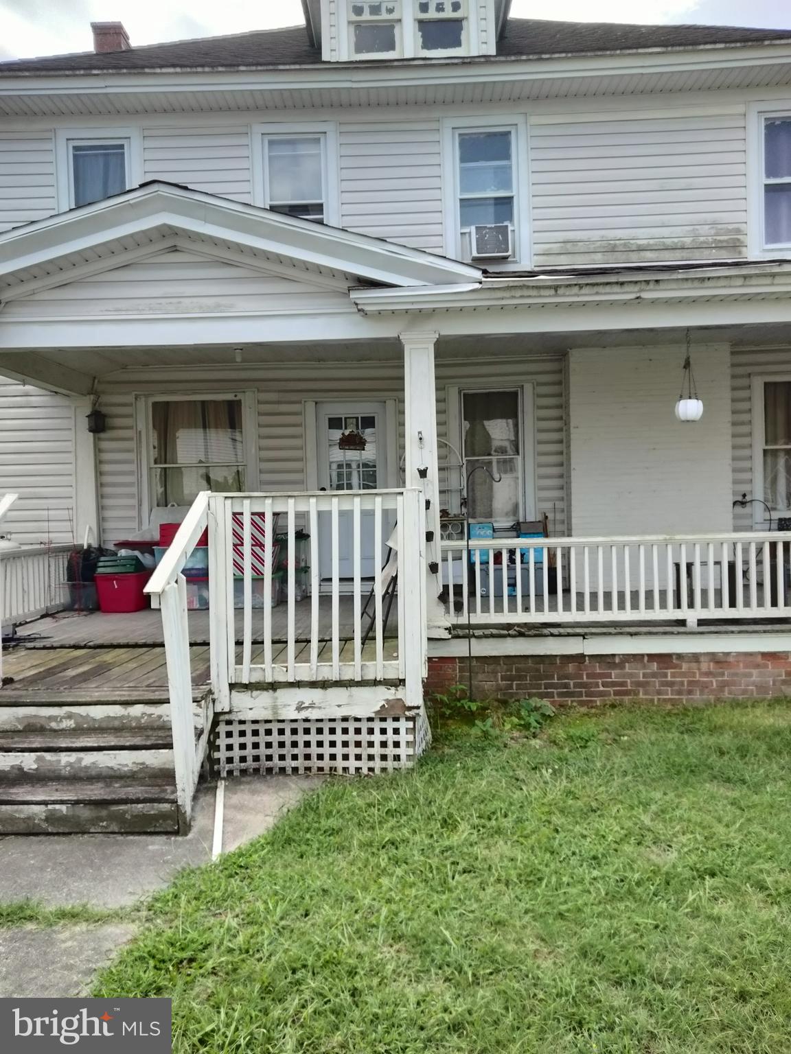 7411 Main Street Willards, MD 21874 - Photo 26 of 43 front view of a house with a small yard