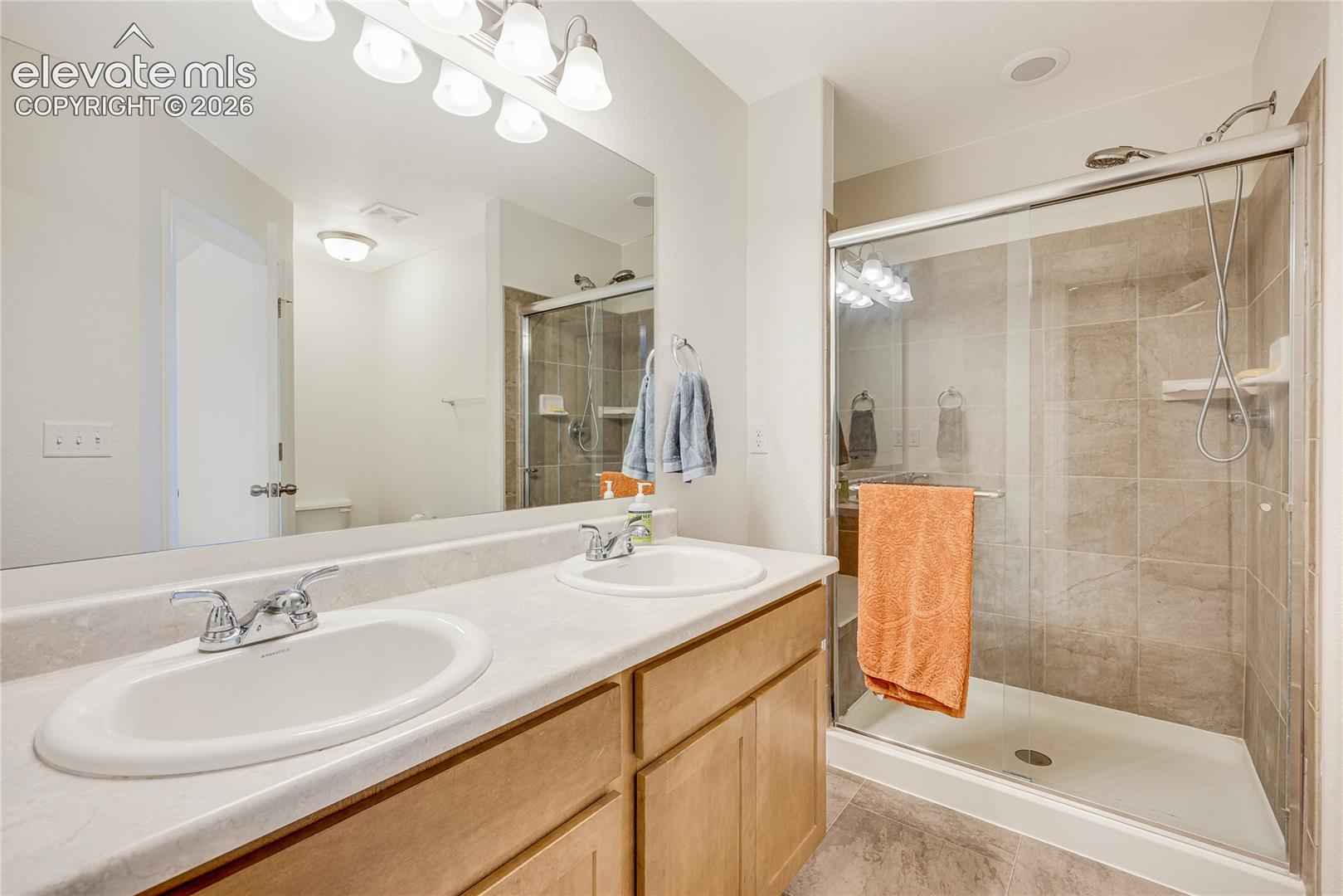 10993 Avena Road Peyton, CO 80831 - Photo 20 of 42 Dual vanity with integrated sinks and chrome fixtures