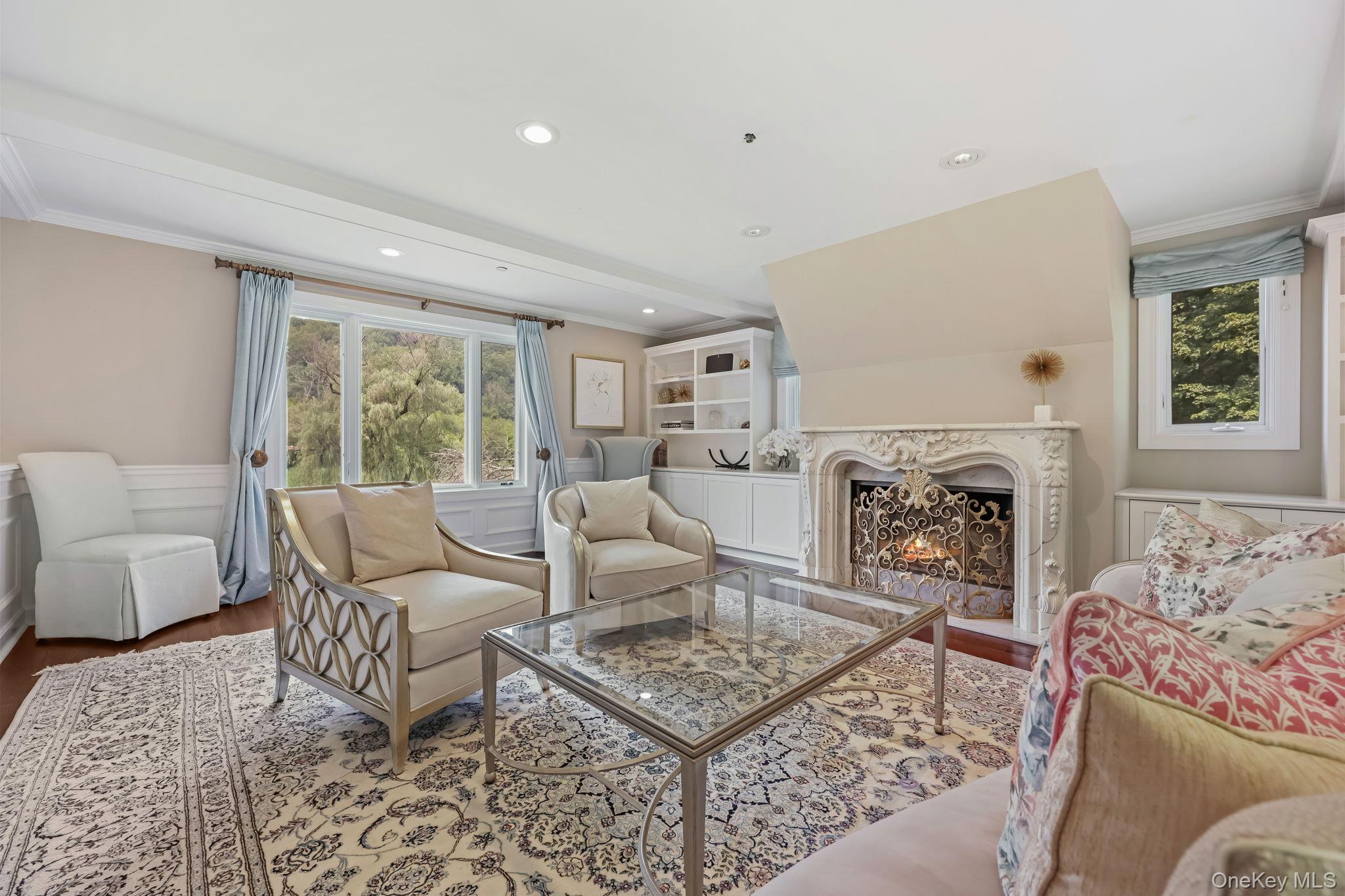 777 Armonk Road Mount Kisco, NY 10549 - Photo 15 of 44 Living room with a premium fireplace, wood finished floors, crown molding, and recessed lighting