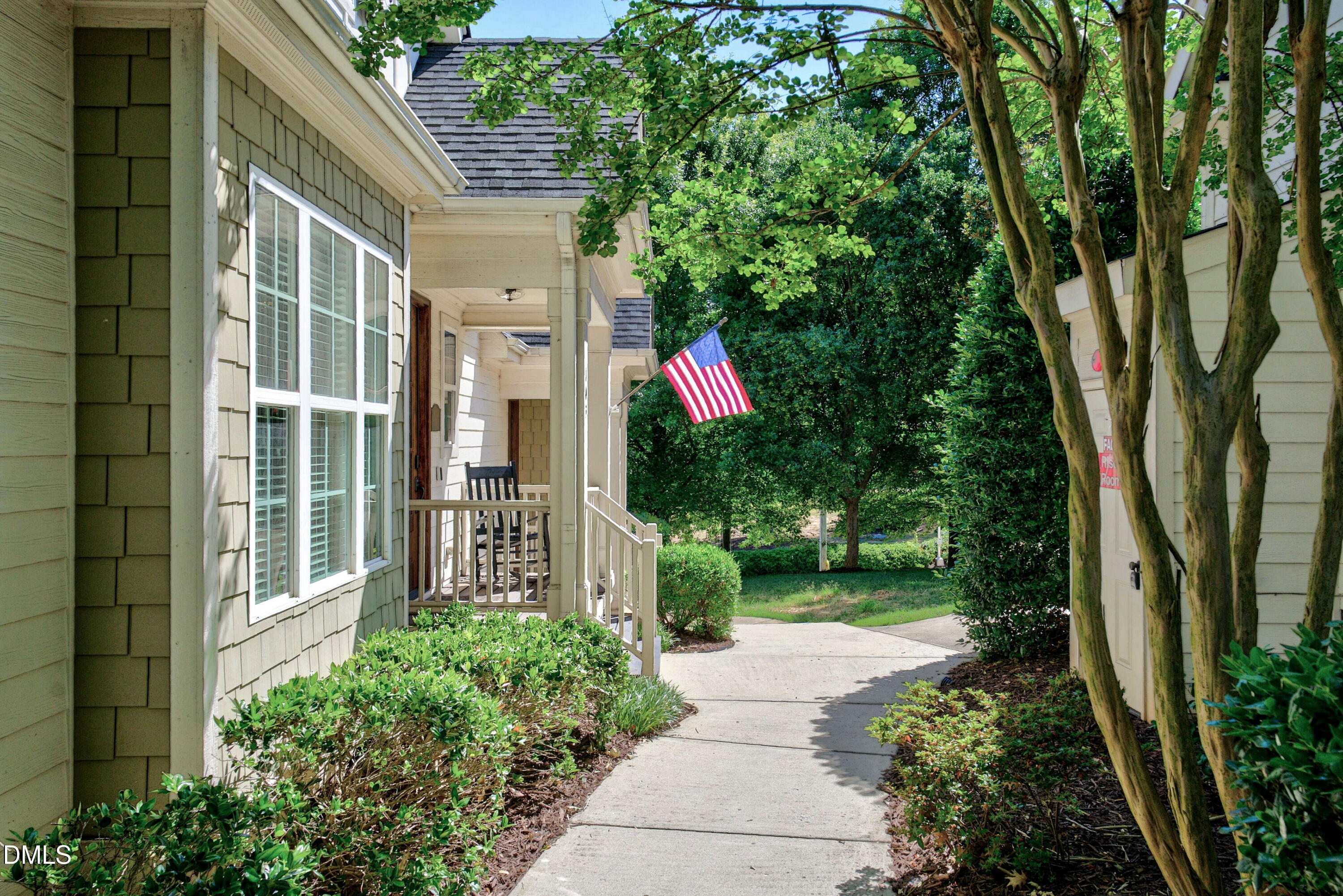 2745 Oberlin Road, Unit 103 Raleigh, NC 27608 - Photo 2 of 23 a front view of a house with a garden