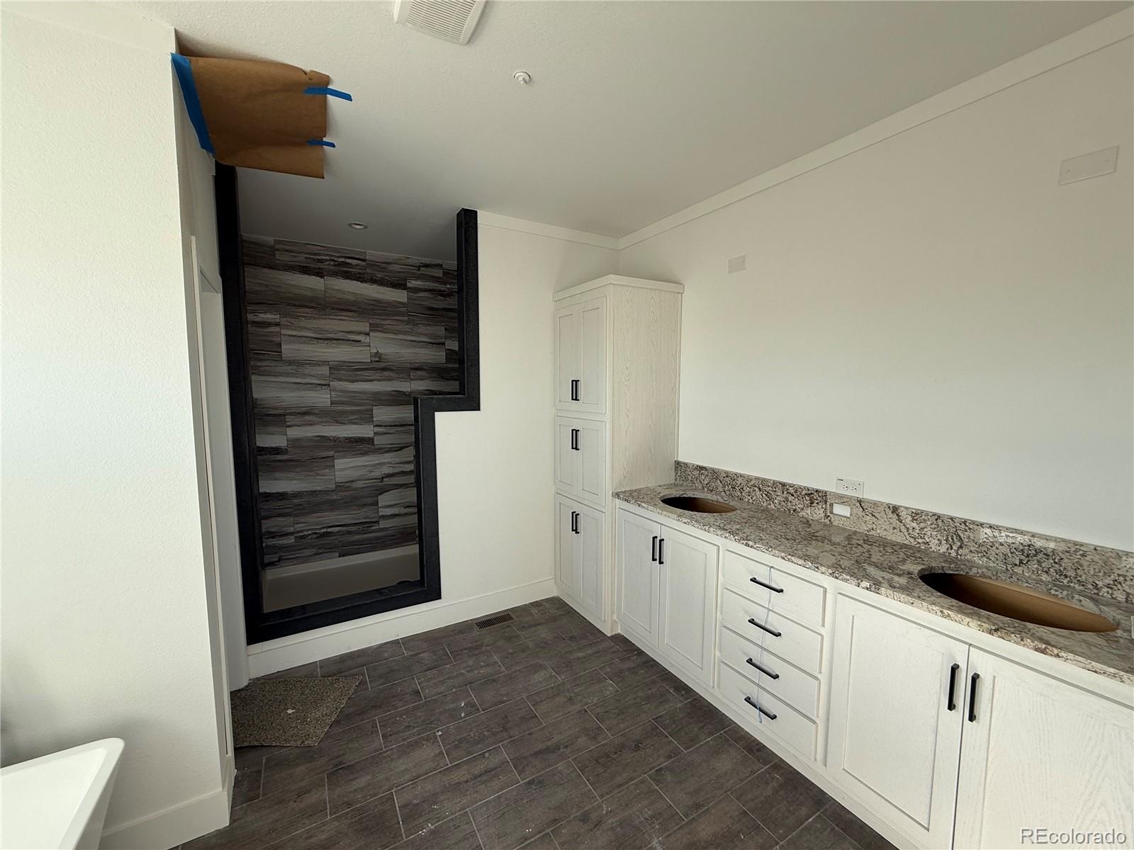 5117 Pass Me By Road Strasburg, CO 80136 - Photo 17 of 19 a kitchen with granite countertop a refrigerator and a stove